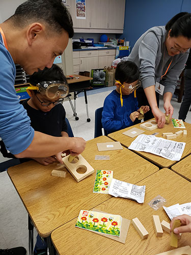 Parents - Parent Volunteers Helping with Flower Pot Project